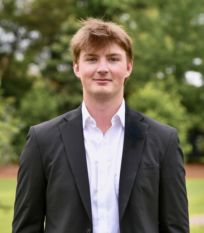 Johnny Bell in a dark blazer and white shirt